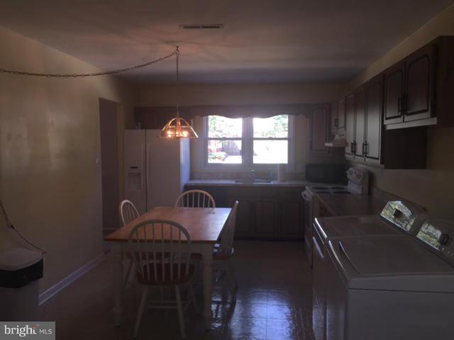 2013 Kennicott Road Baltimore, MD 21244 - Photo 6 of 12 a kitchen with furniture and a window