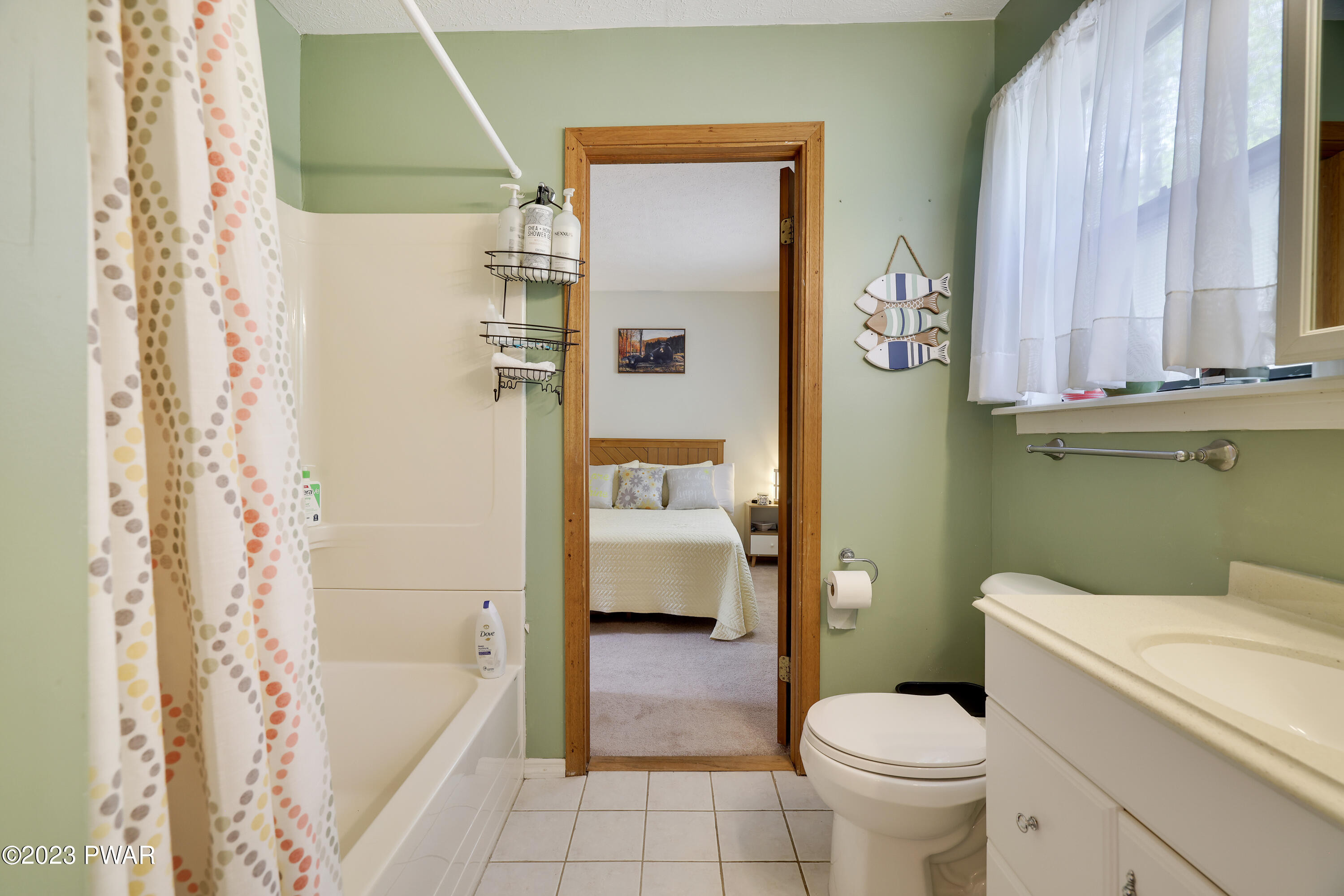 884 Goose Pond Road Lake Ariel, PA 18436 - Photo 16 of 39 a bathroom with a toilet sink and tub