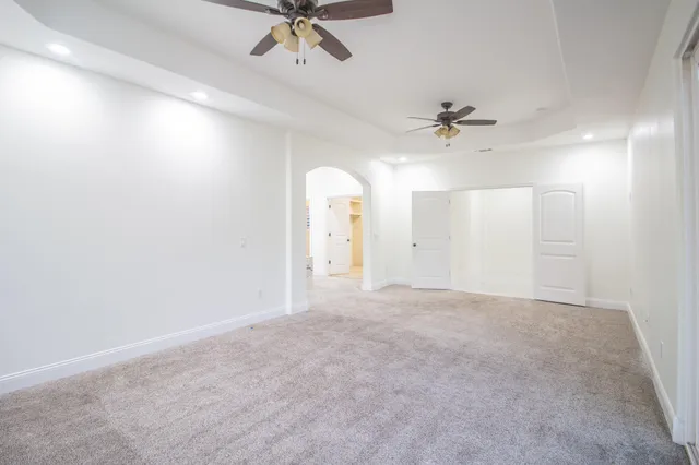 a bathroom with a granite countertop sink mirror and a shower