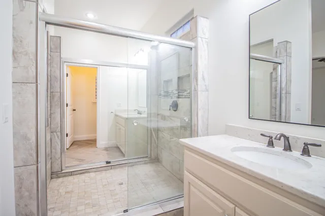 a bathroom with a toilet a sink and a mirror