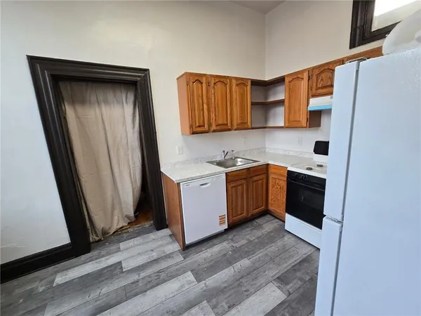 a view of a kitchen with a sink and dishwasher