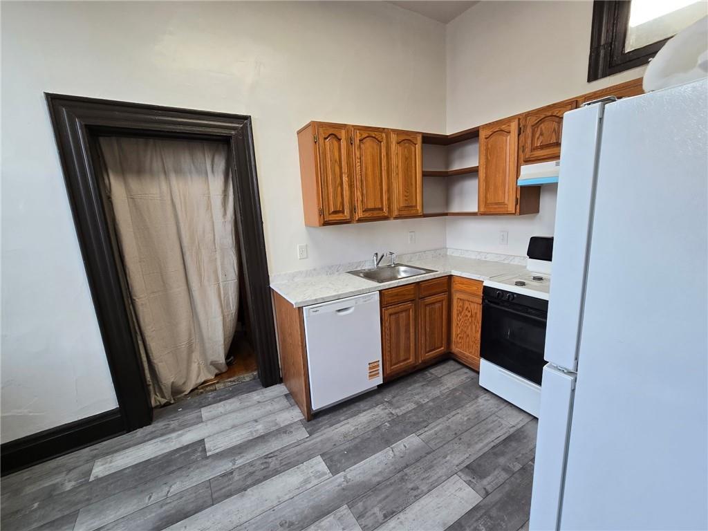 a view of a kitchen with a sink and dishwasher