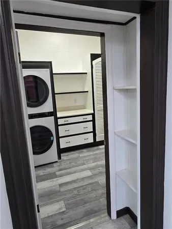 a view of bedroom with wooden floor