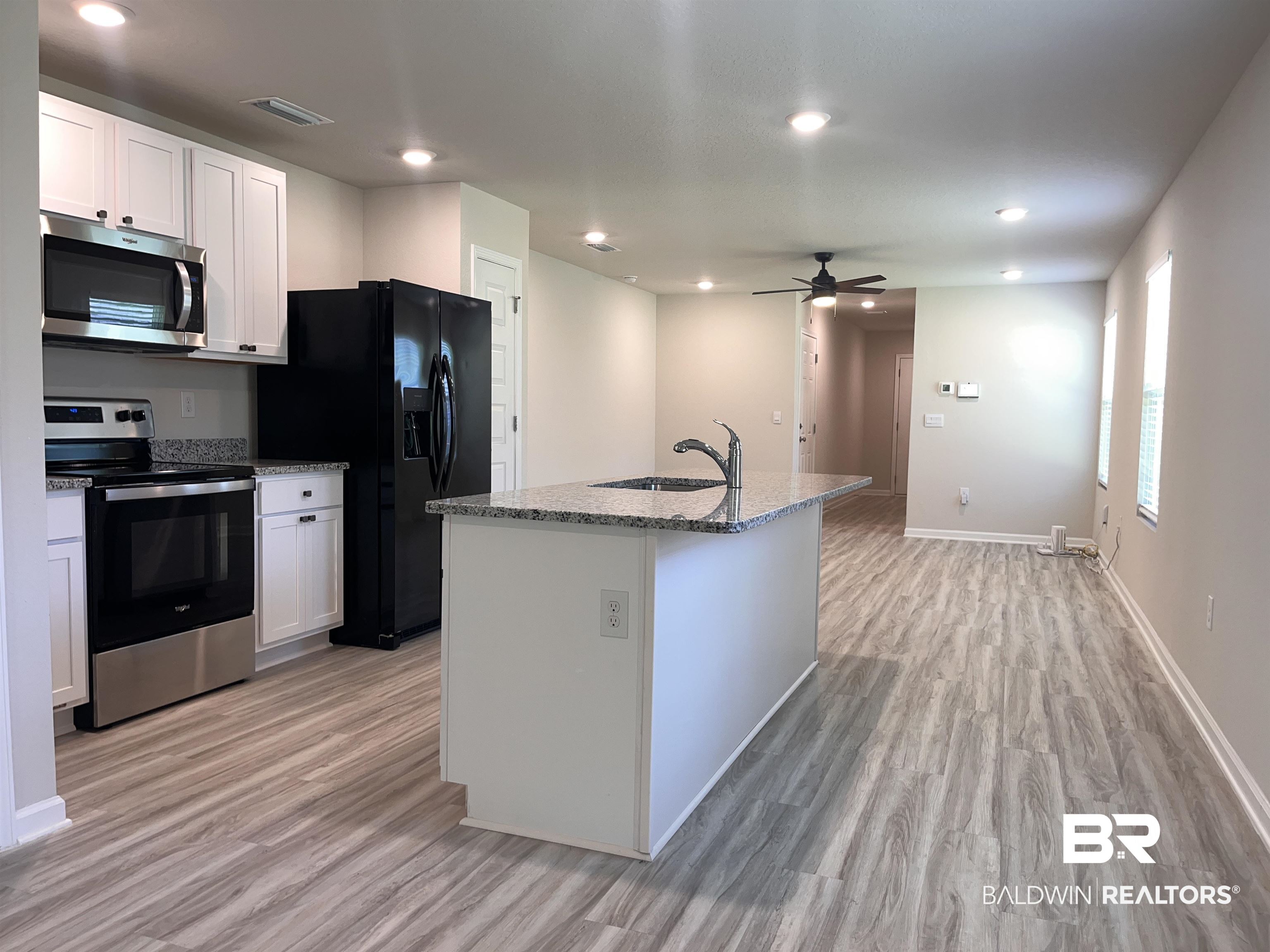 8891 Summer Bay Lane Foley, AL 36535 - Photo 16 of 54 Granite countertops & upgraded cabinet hardware.
