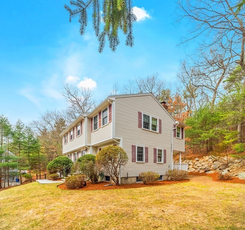 59 Rattlesnake Hill Road Andover, MA 01810 - Photo 1 of 39 a front view of a house with a yard