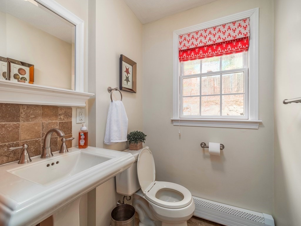 59 Rattlesnake Hill Road Andover, MA 01810 - Photo 15 of 39 a bathroom with a sink a toilet and a window
