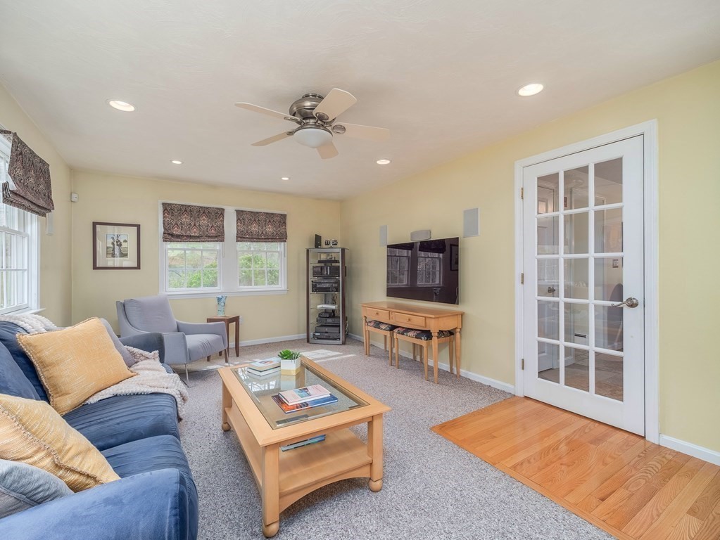 59 Rattlesnake Hill Road Andover, MA 01810 - Photo 17 of 39 a living room with furniture and a flat screen tv
