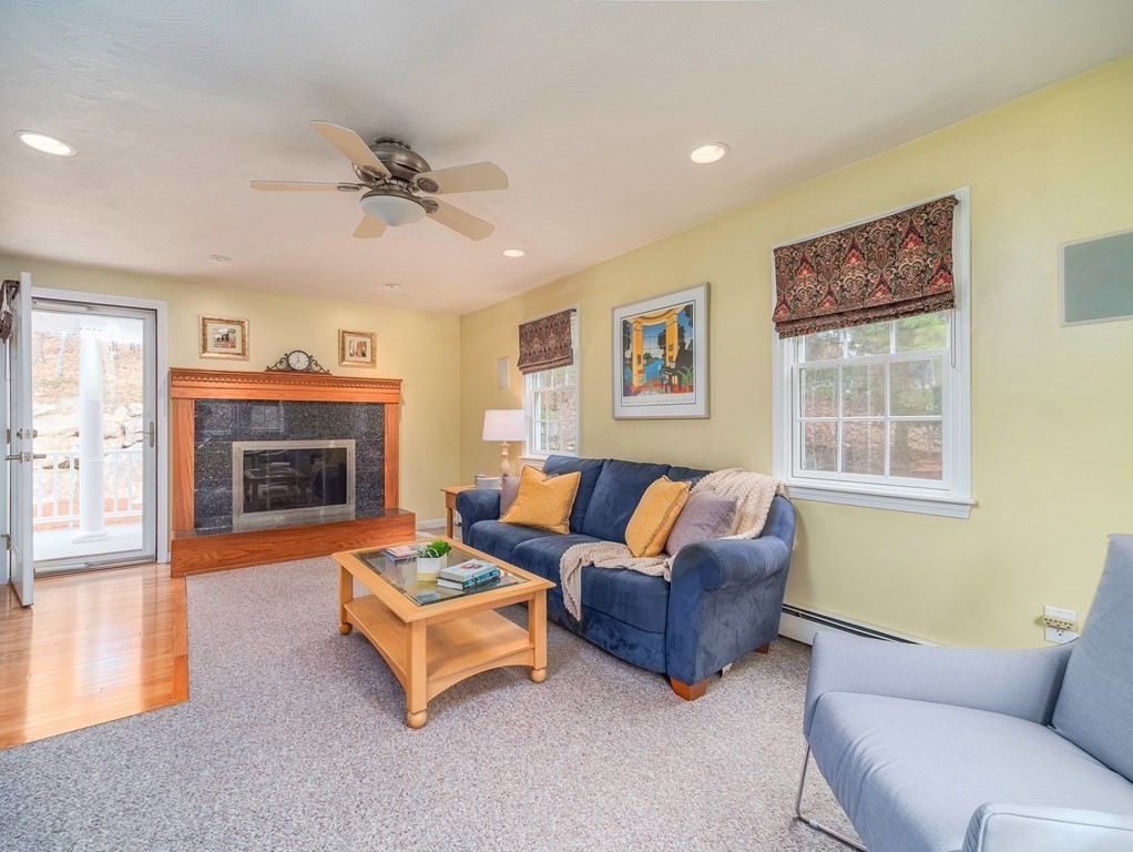 59 Rattlesnake Hill Road Andover, MA 01810 - Photo 19 of 39 a living room with furniture and a fireplace