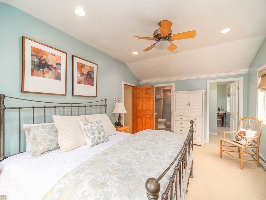 59 Rattlesnake Hill Road Andover, MA 01810 - Photo 23 of 39 a bedroom with a bed and a chandelier