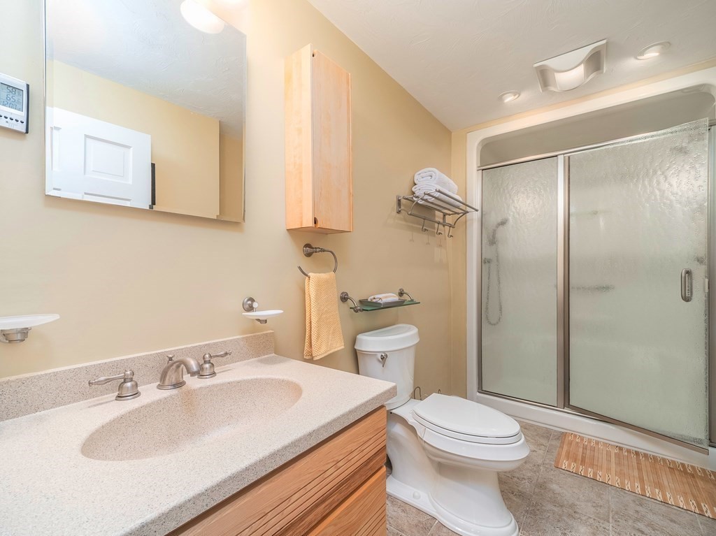 59 Rattlesnake Hill Road Andover, MA 01810 - Photo 25 of 39 a bathroom with a sink toilet and shower