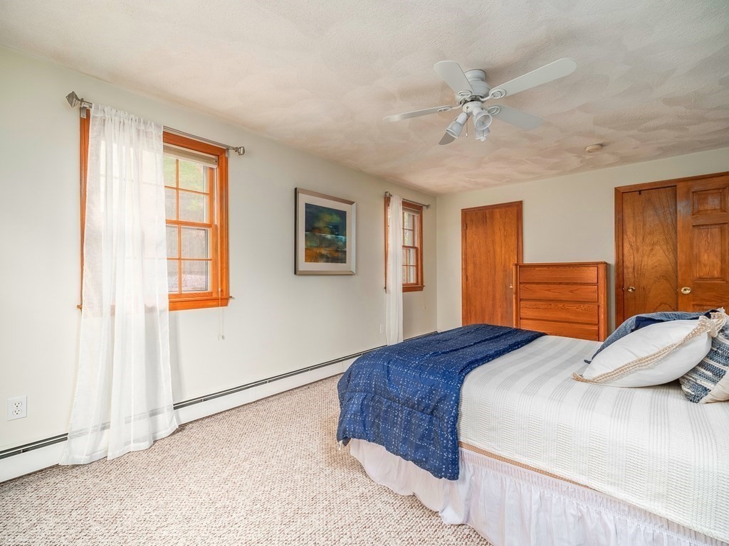 59 Rattlesnake Hill Road Andover, MA 01810 - Photo 27 of 39 a bedroom with a large bed and a window