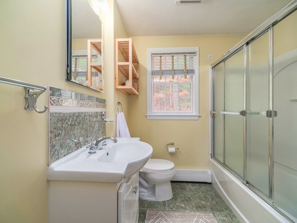 59 Rattlesnake Hill Road Andover, MA 01810 - Photo 28 of 39 a bathroom with a sink toilet and shower