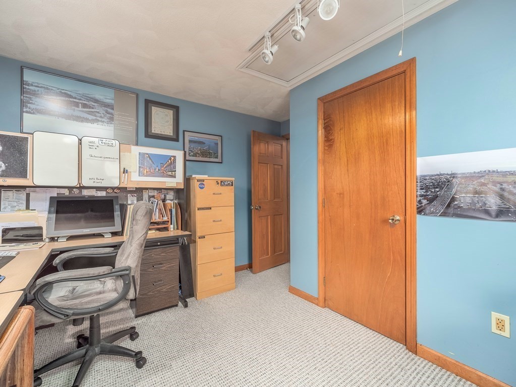 59 Rattlesnake Hill Road Andover, MA 01810 - Photo 32 of 39 a room with furniture and a window