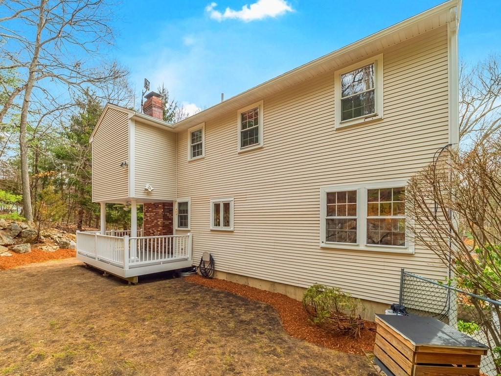 59 Rattlesnake Hill Road Andover, MA 01810 - Photo 36 of 39 a view of a house with a backyard