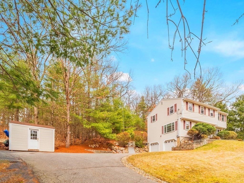 59 Rattlesnake Hill Road Andover, MA 01810 - Photo 38 of 39 a view of a building with large trees