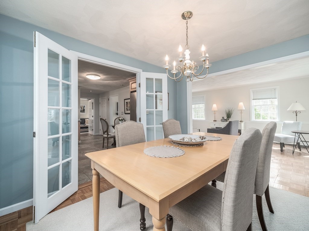 59 Rattlesnake Hill Road Andover, MA 01810 - Photo 8 of 39 a view of a dining room with furniture and chandelier