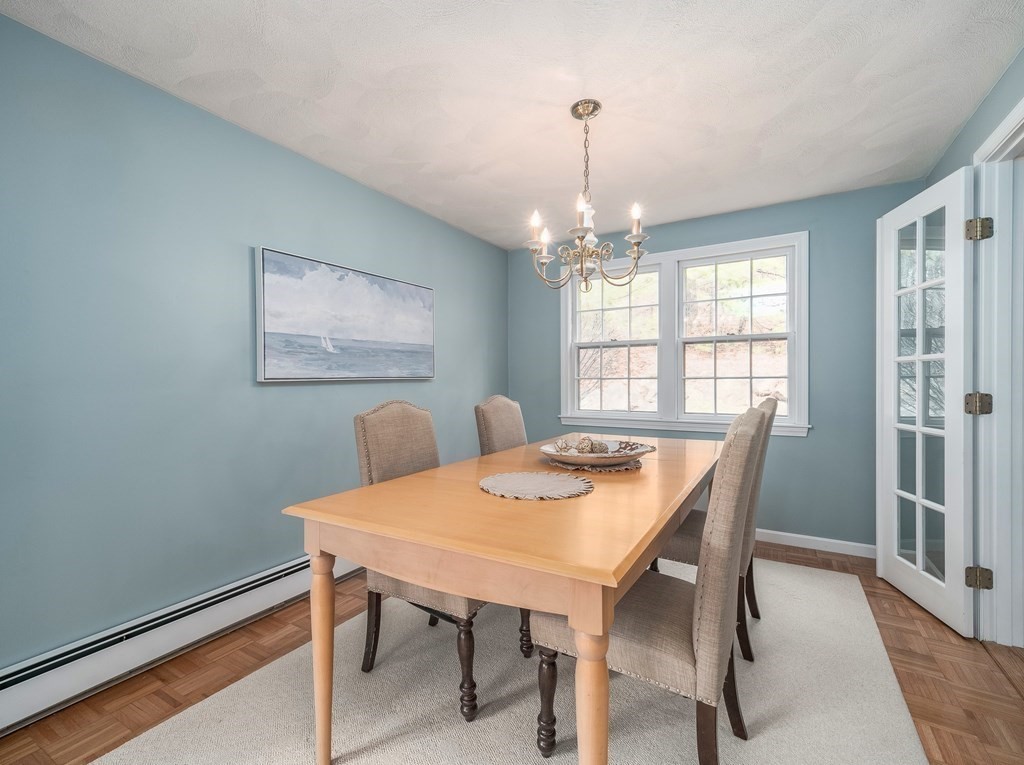 59 Rattlesnake Hill Road Andover, MA 01810 - Photo 9 of 39 a view of a dining room with furniture window and wooden floor
