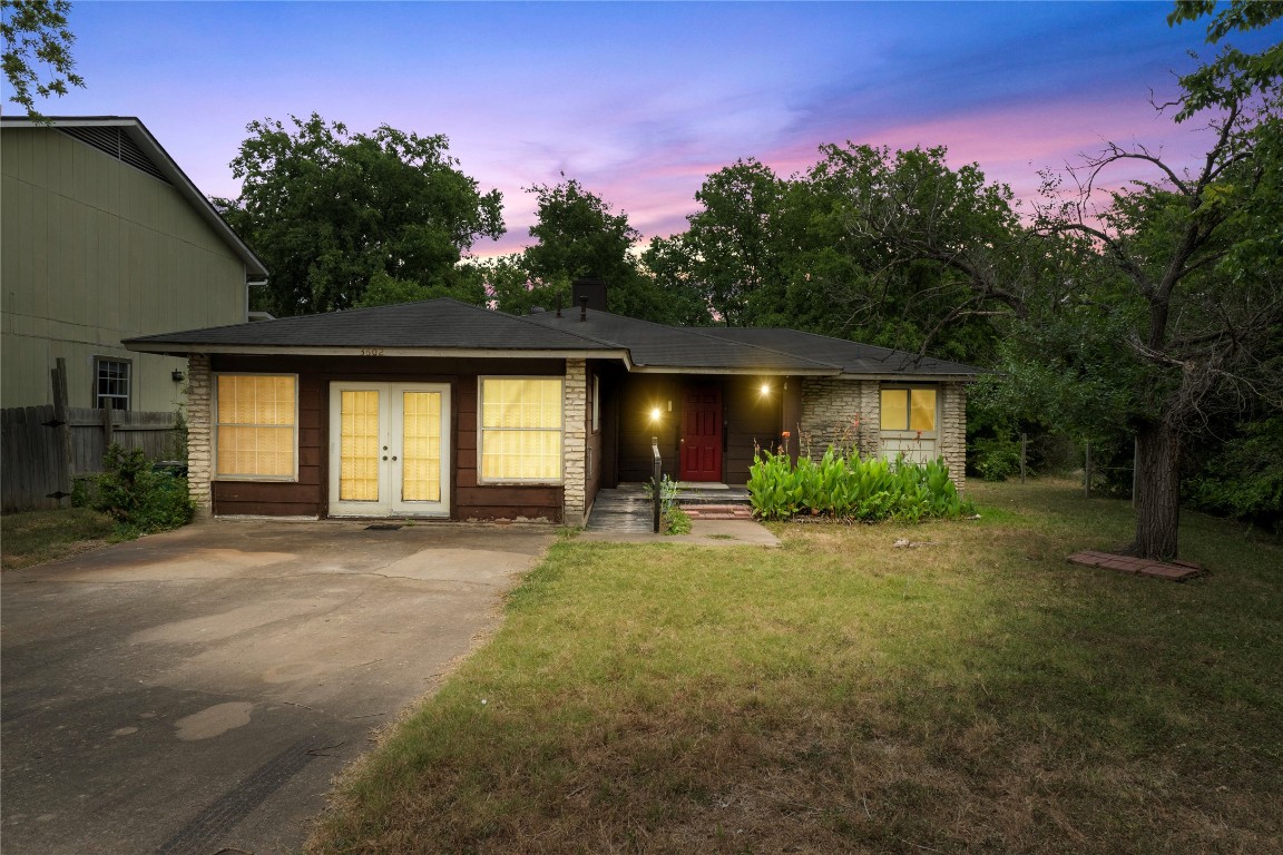 3602 Alexandria Drive Austin, TX 78749 - Photo 1 of 1 a front view of a house with garden