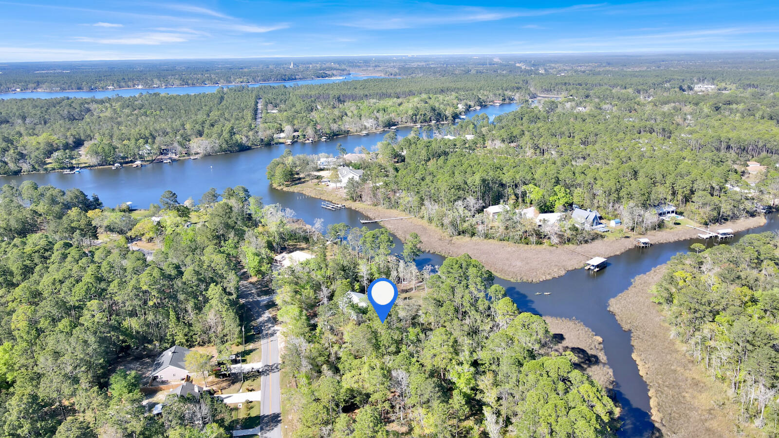Lot 4 Bay Grove Road Freeport, FL 32439 - Photo 3 of 9 a view of a lake with a mountain in the background
