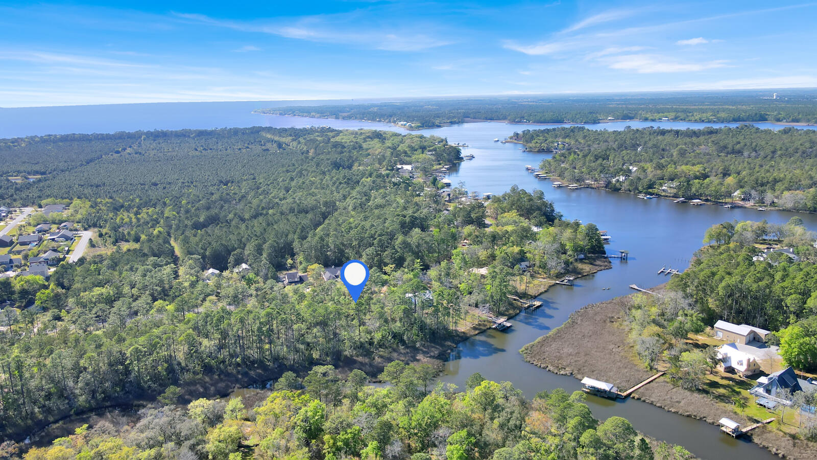 Lot 4 Bay Grove Road Freeport, FL 32439 - Photo 8 of 9 a view of a lake with a city