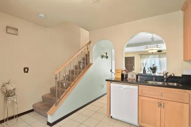 a view of hall with living room and entryway