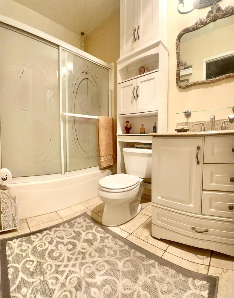 10158 Carefree Drive Santee, CA 92071 - Photo 22 of 38 a bathroom with a toilet and a shower