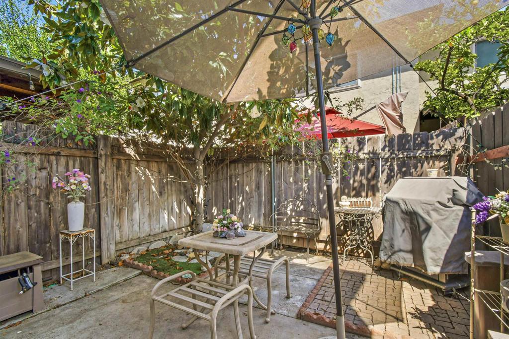 10158 Carefree Drive Santee, CA 92071 - Photo 27 of 38 a view of a patio with table and chairs and potted plants