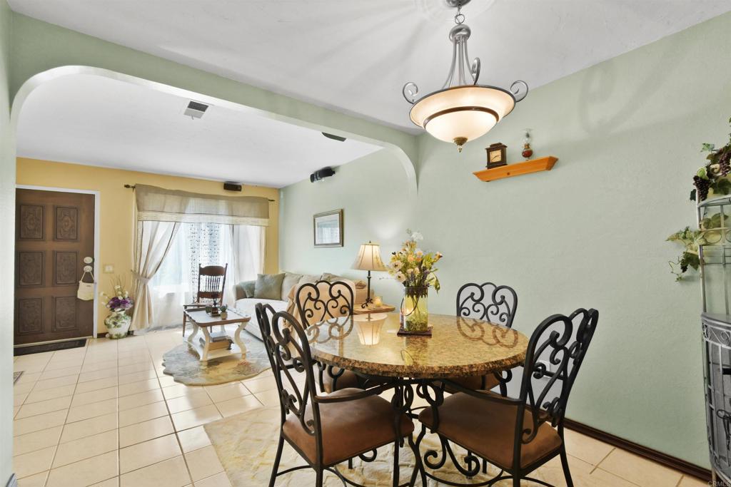 10158 Carefree Drive Santee, CA 92071 - Photo 7 of 38 a view of a dining room with furniture and chandelier
