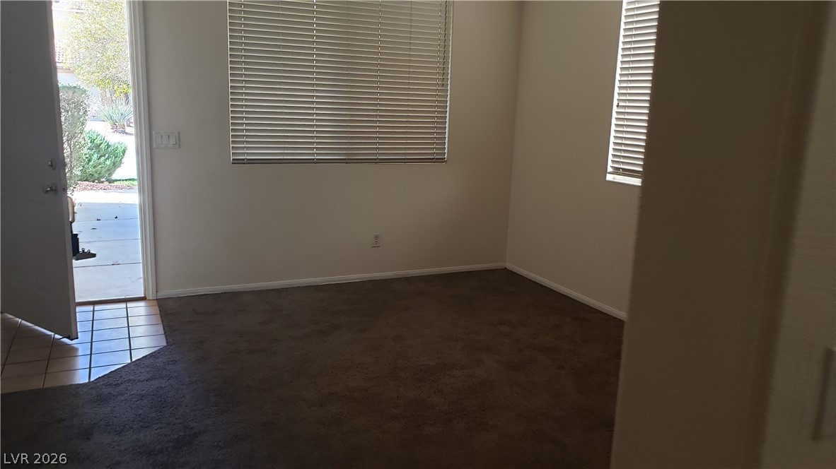 9112 Manalang Road Las Vegas, NV 89123 - Photo 38 of 50 A welcoming entry space with a mixture of practical tiled flooring and plush carpeting.