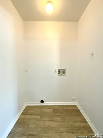 a view of a small space with wooden floor