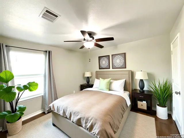 a bedroom with a bed and a potted plant