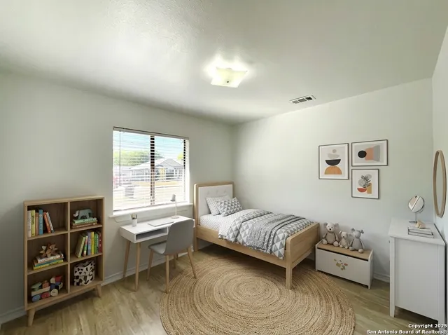 a bedroom with a bed and a window