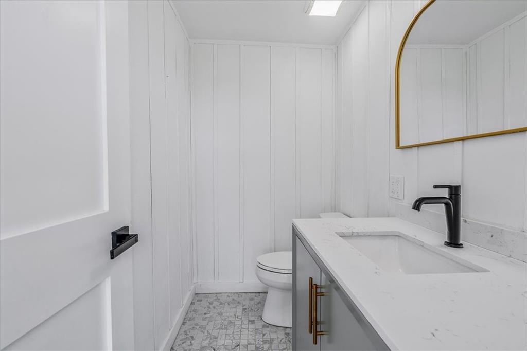 4401 Battle Ridge Road Oakdale, PA 15071 - Photo 26 of 50 a bathroom with a sink a toilet and a mirror