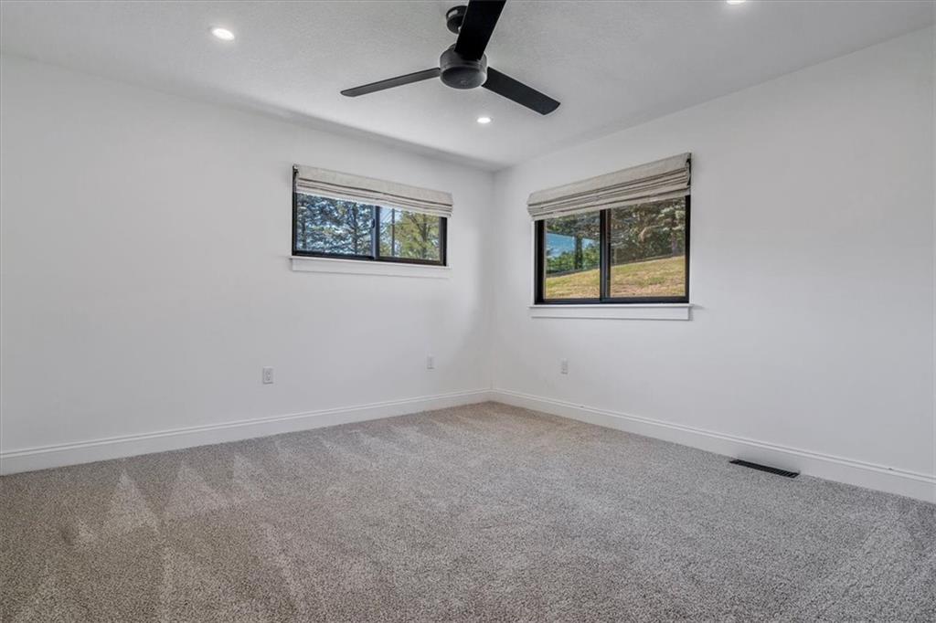 4401 Battle Ridge Road Oakdale, PA 15071 - Photo 38 of 50 an empty room with windows and fan