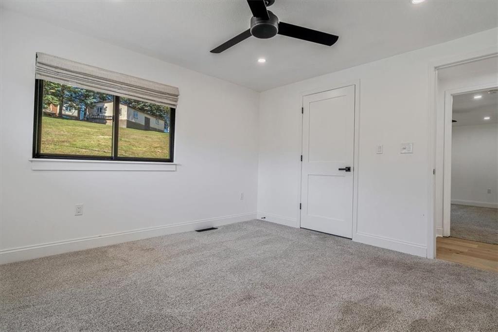 4401 Battle Ridge Road Oakdale, PA 15071 - Photo 39 of 50 an empty room with windows and fan