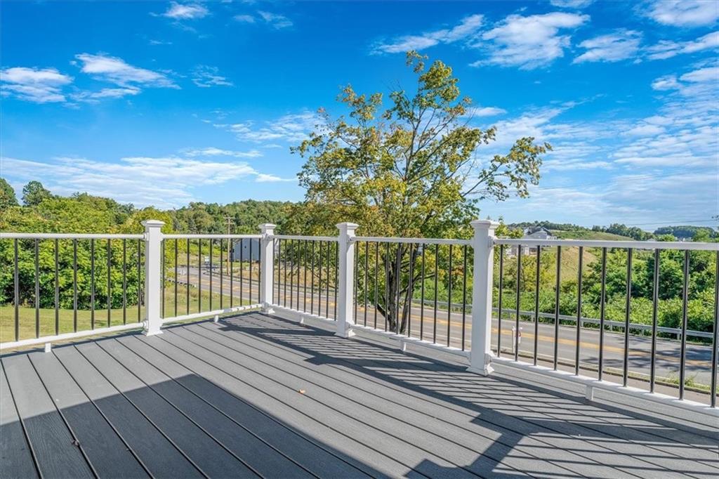 4401 Battle Ridge Road Oakdale, PA 15071 - Photo 46 of 50 a view of a balcony with wooden floor and fence