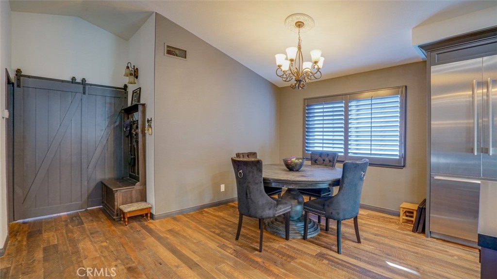 11327 Old Ranch Circle Chatsworth, CA 91311 - Photo 11 of 63 a view of a dining room with furniture and a chandelier