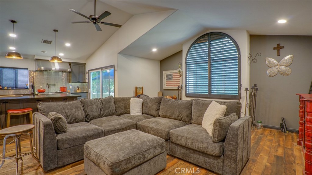 11327 Old Ranch Circle Chatsworth, CA 91311 - Photo 15 of 63 a living room with furniture and a large window