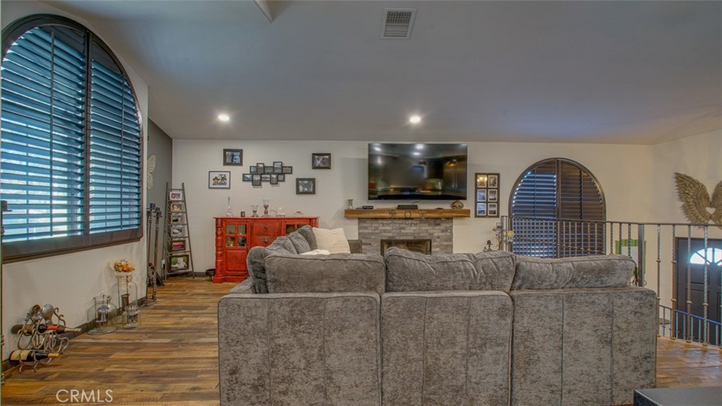 11327 Old Ranch Circle Chatsworth, CA 91311 - Photo 17 of 63 a living room with furniture and a wooden floor