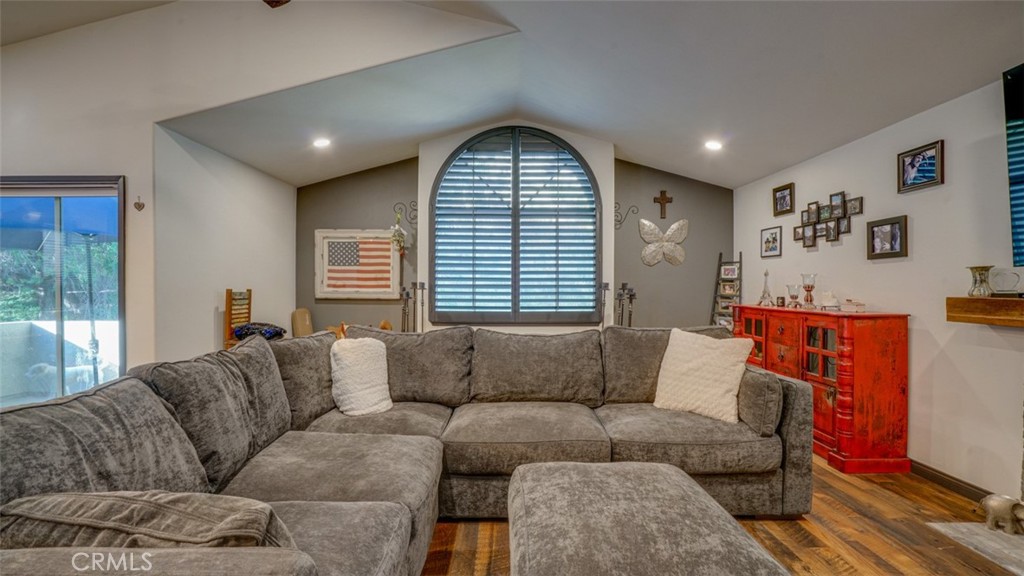 11327 Old Ranch Circle Chatsworth, CA 91311 - Photo 18 of 63 a living room with furniture and a large window