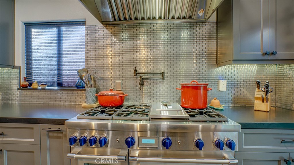 11327 Old Ranch Circle Chatsworth, CA 91311 - Photo 21 of 63 a stove top oven sitting inside of a kitchen