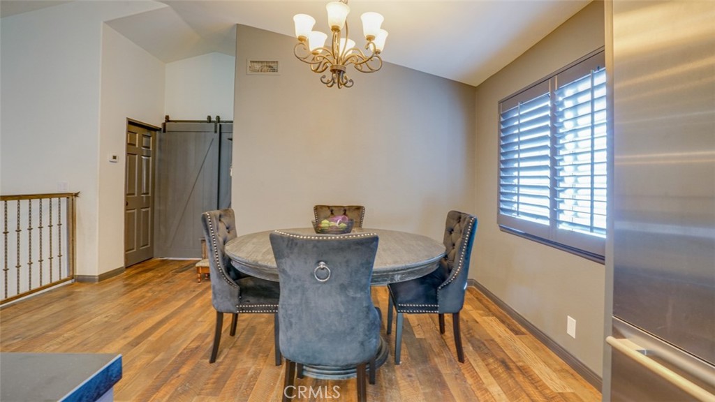 11327 Old Ranch Circle Chatsworth, CA 91311 - Photo 24 of 63 a view of a dining room with furniture window and wooden floor