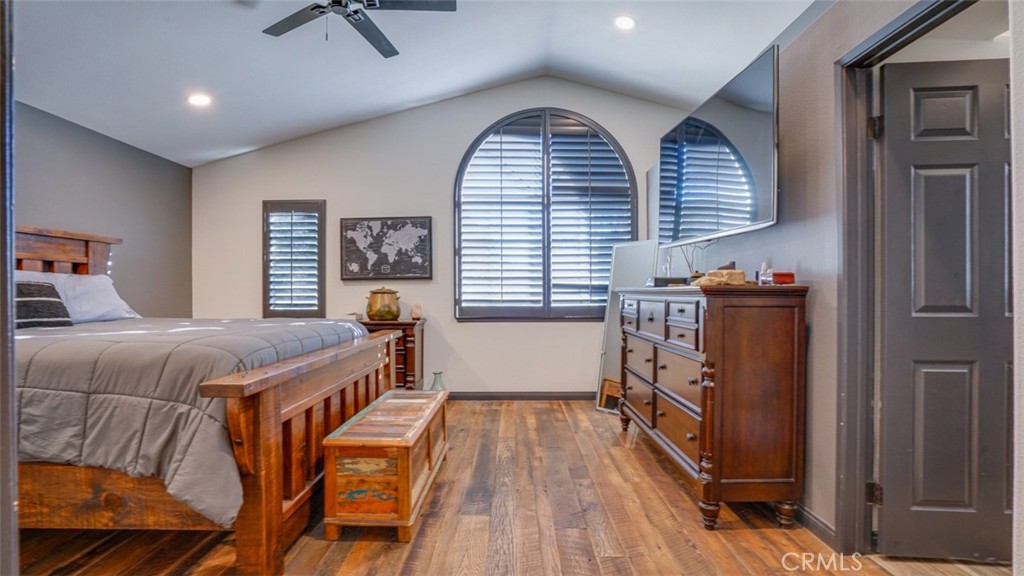 11327 Old Ranch Circle Chatsworth, CA 91311 - Photo 29 of 63 a bedroom with a bed and wooden floor