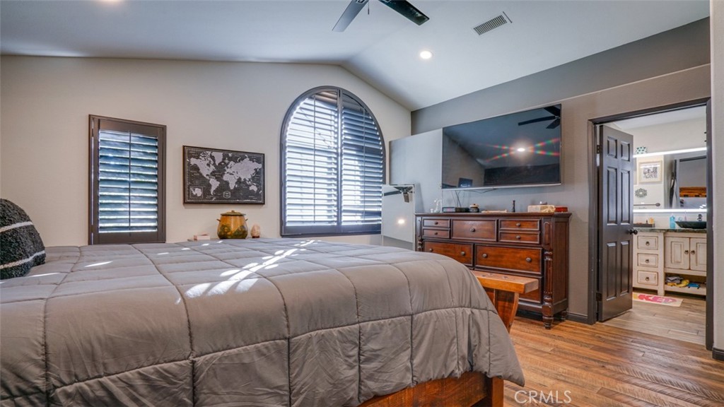 11327 Old Ranch Circle Chatsworth, CA 91311 - Photo 30 of 63 a bedroom with a bed and a flat screen tv