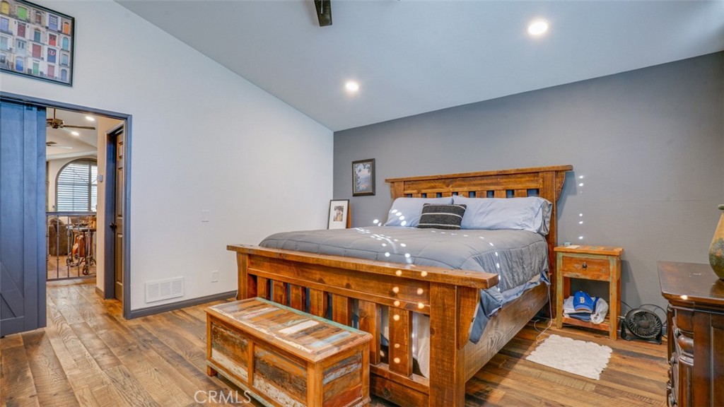 11327 Old Ranch Circle Chatsworth, CA 91311 - Photo 32 of 63 a bedroom with a bed and wooden floor