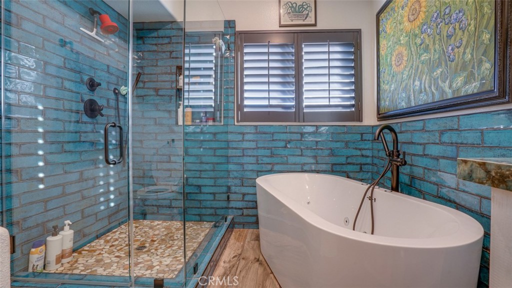 11327 Old Ranch Circle Chatsworth, CA 91311 - Photo 35 of 63 a bathroom with a bathtub and shower