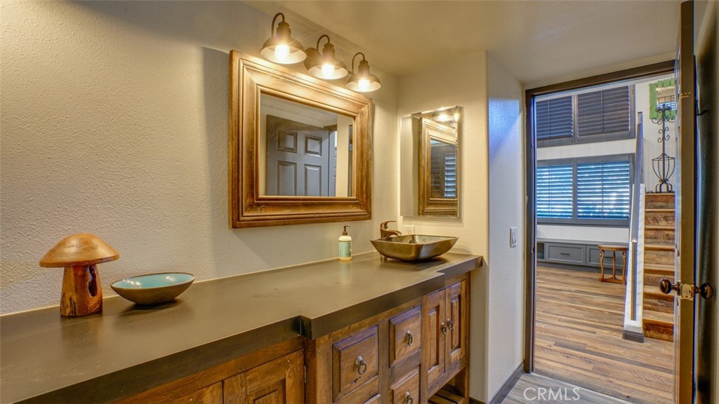 11327 Old Ranch Circle Chatsworth, CA 91311 - Photo 42 of 63 a bathroom with a sink and a mirror