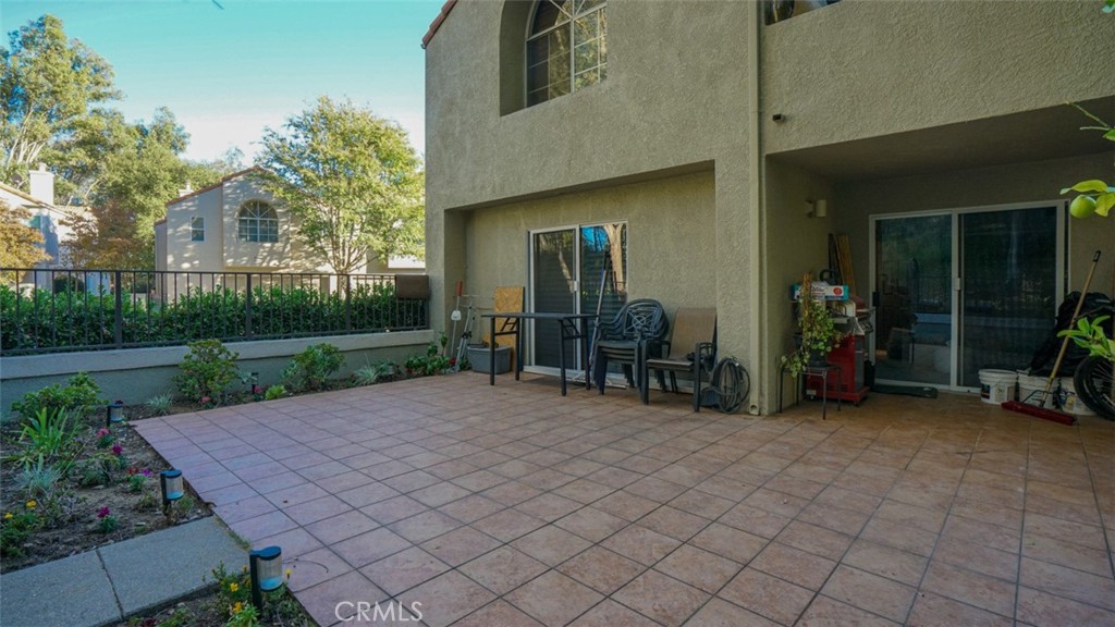 11327 Old Ranch Circle Chatsworth, CA 91311 - Photo 48 of 63 a view of a chair and table in backyard of the house