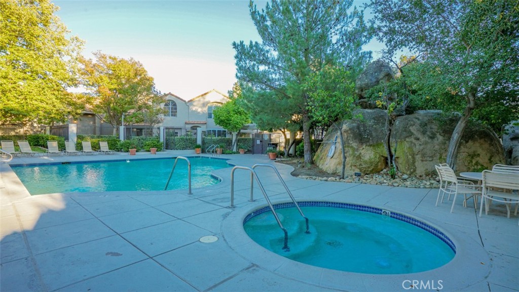 11327 Old Ranch Circle Chatsworth, CA 91311 - Photo 50 of 63 a view of a swimming pool with a patio