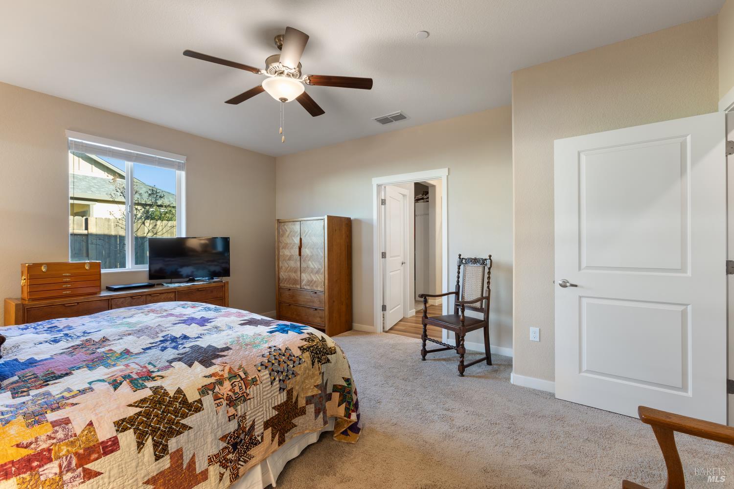 2080 Revival Lane Rio Vista, CA 94571 - Photo 26 of 40 a bedroom with a bed and a chandelier